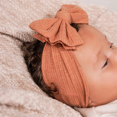 Babygirl wearing Orange Ribbed Headband